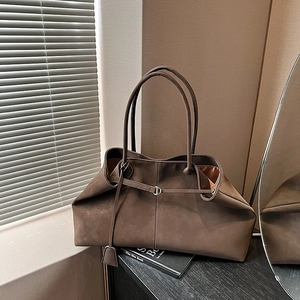 Detailed close-up of dark coffee tote bag featuring matte texture and D-ring buckle