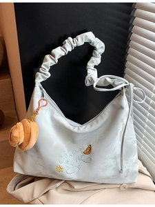 Light blue ruched nylon tote bag with cloud texture, embroidery and plush charm