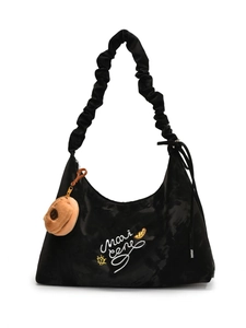 Black crescent bag with scrunchie strap, artistic embroidery, and donut plush charm