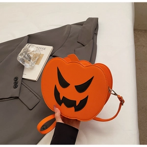 Detail of Halloween pumpkin crossbody bag with jack-o'-lantern face and adjustable strap