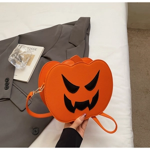 Close-up of Halloween pumpkin crossbody bag with jack-o'-lantern face and cross-grain leather