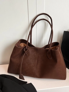 Large dark brown matte leather tote bag for women with minimalist shoulder strap design