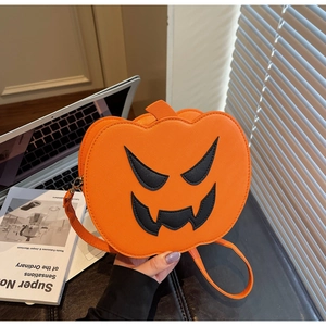 Detail of orange pumpkin-shaped crossbody bag made of lychee grain PU leather for Halloween