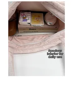 Detailed view of the large capacity quilted tote bag showing spacious inner lining and pockets