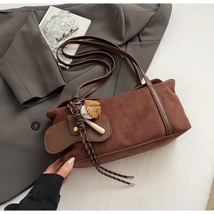 Brown suede shoulder tote bag with CLEAROK embossing and baseball charm accessory