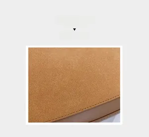 Détail de couture sur daim marron et cuir avec texte imprimé blanc élégant