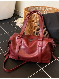 Large burgundy soft faux leather tote bag with double handles and shoulder strap