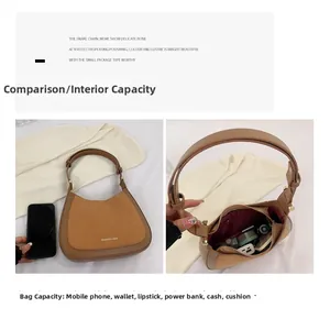 Vue détaillée montrant la grande capacité de rangement du sac sous les bras marron