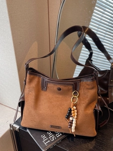 Brown suede tote bag for women with leather trim and wooden bead charm accessory