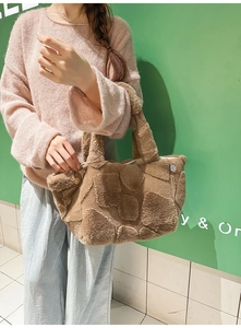 Detail of plush khaki tote bag featuring geometric textured fur and large capacity style