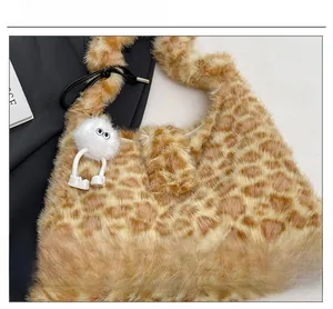 Detailed view of the soft leopard print faux fur texture and cute monster charm