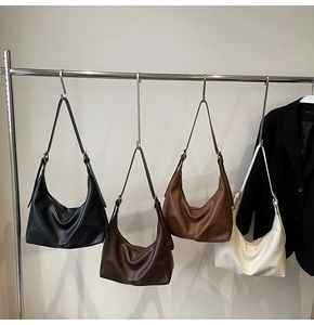 Detailed view of large hobo bags in black, dark coffee, caramel brown and cream white