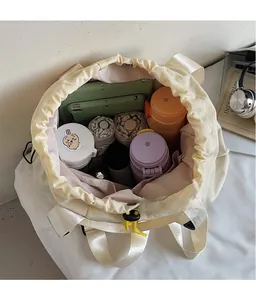 Top-down view of spacious drawstring backpack interior with multi-pocket organizer layers