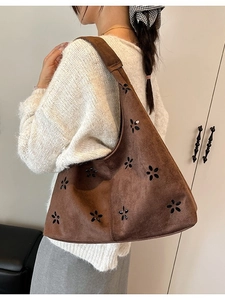 Dark brown suede hobo bag with floral hollow cutouts for casual commuting wear