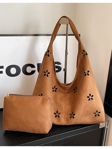 Brown faux suede tote bag set with laser-cut floral patterns and small matching pouch