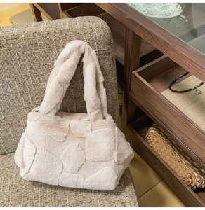 Close-up of diamond-stitched faux fur tote bag with soft texture and beige finish