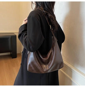 Retro dark brown oil wax leather tote bag shown from a stylish side-back view for daily use