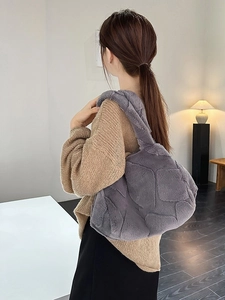 Gray faux fur tote bag with geometric embossed pattern and plush shoulder strap for women