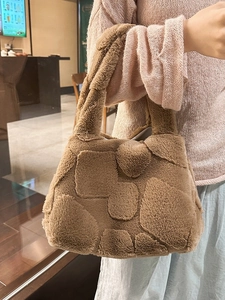 Brown fuzzy tote bag with embossed heart pattern made of soft faux fur for autumn winter