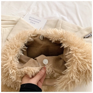 Close-up of beige faux fur tote bag showing magnetic closure and brown suede lining