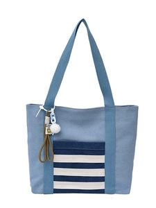Light blue canvas tote bag with striped front pocket and decorative plush charm