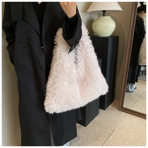 Detail of soft pink faux fur tote bag showing the plush texture and large capacity