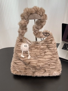 Fuzzy faux fur tote bag with brown stripes and cute monster pendant for autumn winter