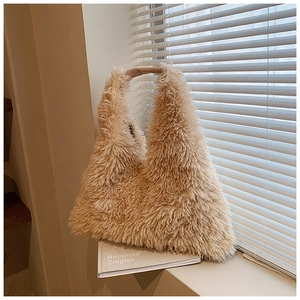 Close-up of the plush beige faux fur texture on this stylish hobo shoulder bag for women