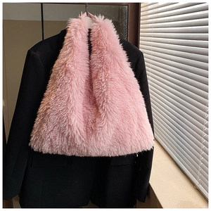 Detail of soft pink faux fur tote bag showing the fluffy texture and shoulder strap