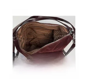 Top view of vintage burgundy tote showing striped lining and metal zipper interior