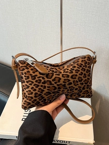 Minimalist leopard print leopard underarm bag with faux fur texture and brown strap