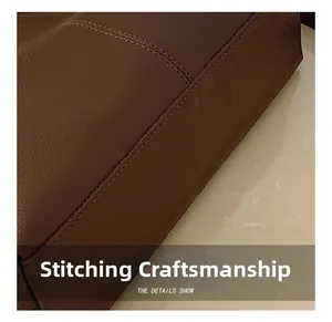 Detailed macro view showing the precise parallel stitching on dark brown leather tote bag