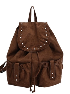 Minimalist caramel brown faux suede backpack with silver rivets and drawstring flap