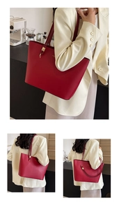 Detail view of the large red leather tote bag with slim shoulder straps for women