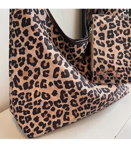 Leopard print tote bag set featuring large capacity canvas texture and matching small pouch