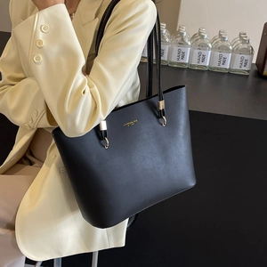Classic black leather tote bag for women with gold hardware and spacious shoulder design