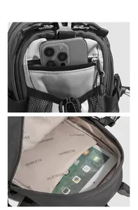 Detail view of the multi-compartment interior and mesh side pocket of the gray backpack