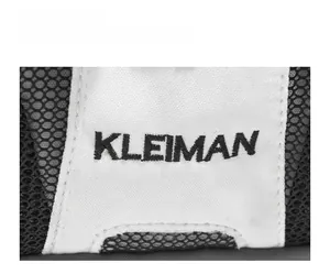 Detail of KLEIMAN brand embroidery on white canvas and black mesh fabric texture