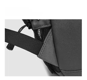 Detail of reinforced stitching and honeycomb mesh pocket on grey nylon sports backpack