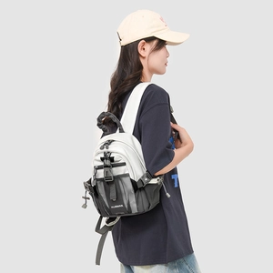 Detail view of mini outdoor backpack with breathable mesh side pockets and strap buckles