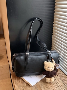 Retro black leather shoulder bag with spacious interior and cute plush bear charm decoration