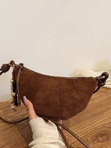 Brown frosted half-moon crossbody bag with beaded pendant and knot shoulder strap