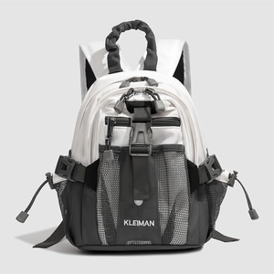 Detailed front view of white and grey mini backpack featuring multiple zipper compartments