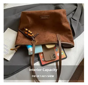 Top view of brown suede tote bag showing large capacity for laptop and cosmetics