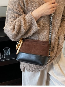 Vintage quilted crossbody bag in brown suede and black leather with wooden bead charm