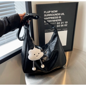 Black glossy pleated underarm bag with a cute white plush cloud charm and silver buckle