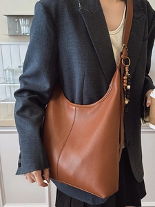 Brown large capacity leather hobo shoulder bag with ethnic bead tassel charm
