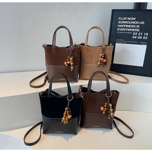 Collection of four vintage matte bucket bags in black brown and khaki with beaded charms
