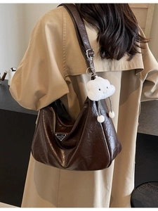 Deep brown glossy pleated leather shoulder bag with vintage metal logo and cloud charm