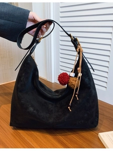 Matte black leather hobo bag with bohemian charm and spacious crescent moon structure